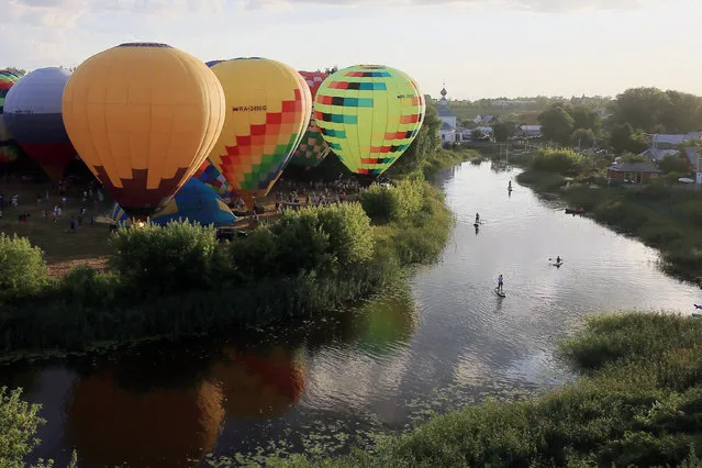 The Russian Golden Ring Balloon Festival takes place near Ilyinsky Meadow in Suzdal, Russia on July 21, 2021. (Photo by Vladimir Smirnov/TASS)