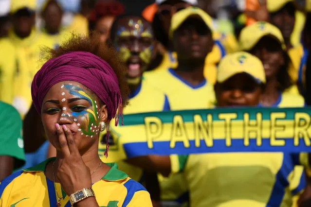 A Gabon supporter blows a kiss ahead of the 2017 Africa Cup of Nations group A football match between Gabon and Burkina Faso at the Stade de l' Amitie Sino- Gabonaise in Libreville on January 18, 2017. (Photo by Gabriel Bouys/AFP Photo)