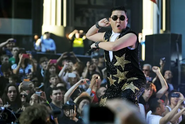 South Korean pop sensation Psy, whose real name is Park Jae-Sang, performs for fans at a promotion by the Sunrise breakfast television show in central Sydney on October 17, 2012. (Photo by Greg Wood/AFP Photo)