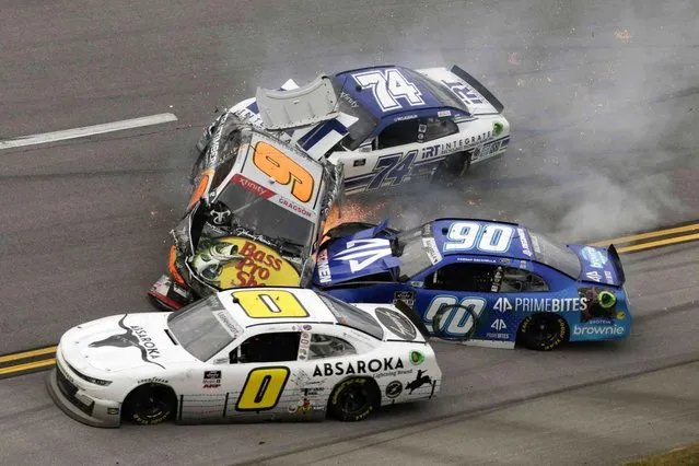 Noah Gragson (9), Caesar Bacarella (9), Jeffrey Earnhardt (0) and C.J. McLaughlin (74) tangle in a wreck during a NASCAR Xfinity Series auto race Saturday, October 2, 2021, in Talladega, Ala. (Photo by Russell Norris/AP Photo)