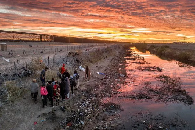 Seen from an aerial view, immigrants wait next to razor wire after crossing the Rio Grande into El Paso, Texas on February 01, 2024 from Ciudad Juarez, Mexico. Those who get through the wire are then allowed to proceed for processing by U.S. Border Patrol agents. (Photo by John Moore/Getty Images)