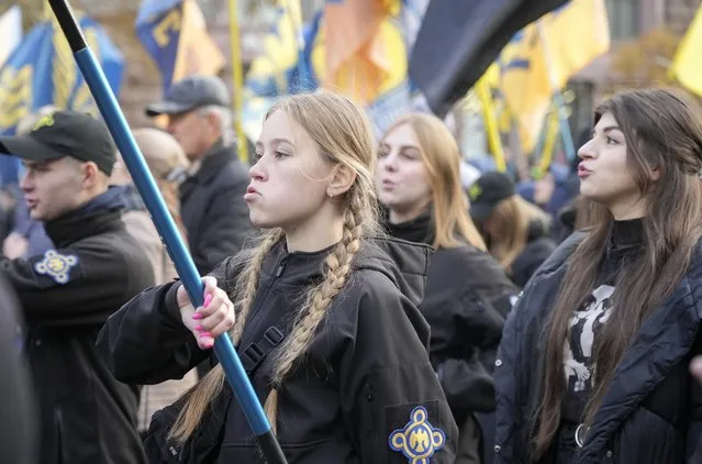 Members of nationalist movements march during a rally marking Defender of Ukraine Day, in center Kyiv, Ukraine, Thursday, October 14, 2021. (Photo by Efrem Lukatsky/AP Photo)