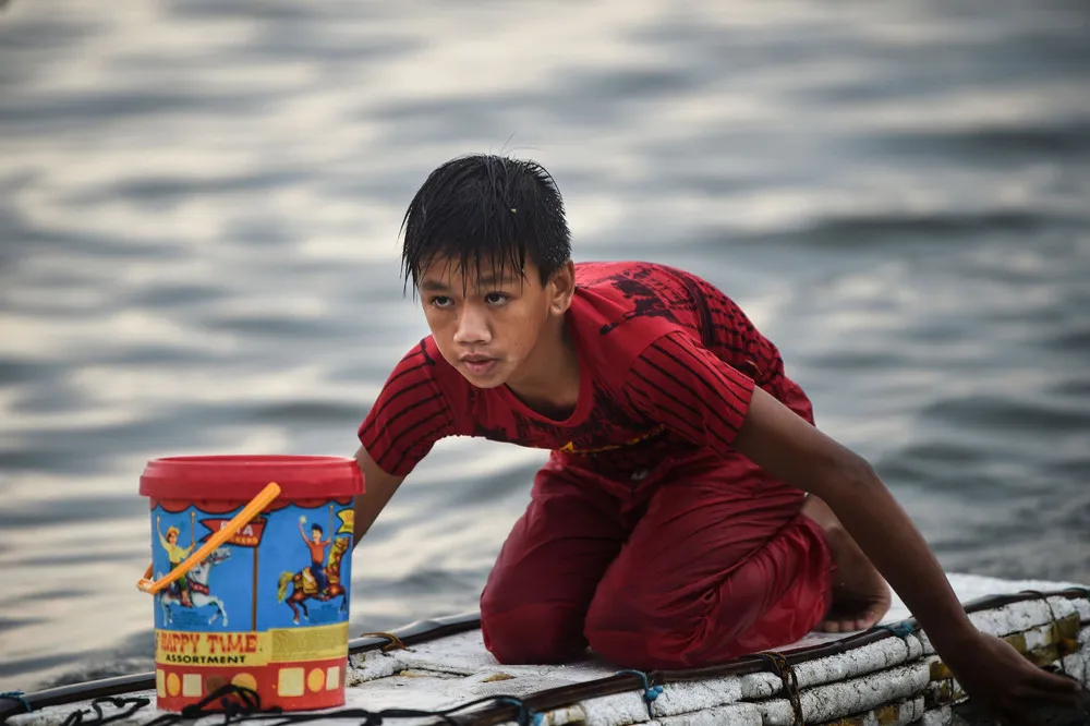 The Boy on a Raft in Manila Bay