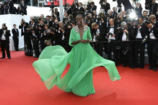 Lupita Nyong'o arrives for the opening ceremony and the screening of the film La Tete Haute (Standing Tall) at the 68th international film festival, Cannes, southern France, Wednesday, May 13, 2015. (Photo by Joel Ryan/Invision/AP Photo)