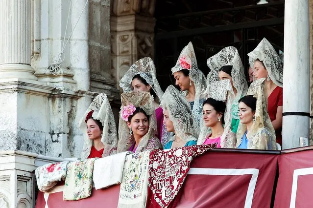 Women dressed with traditional dresses attend April's Fair bullfighting at Real Maestranza bullring in Seville, Andalusia, Spain, 06 May 2019. (Photo by Julio Munoz/EPA/EFE)