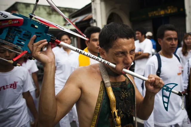 Devotees Practice Self Mutilation At Phuket Vegetarian Festival