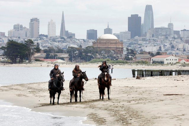 Actors wearing ape costumes are filmed by a Disney marketing team as they ride on horseback at Crissy Field as “Kingdom of the Planet of the Apes” is promoted in the city on Wednesday, April 24, in San Francisco. (Photo by Lea Suzuki/San Francisco Chronicle via AP Photo)