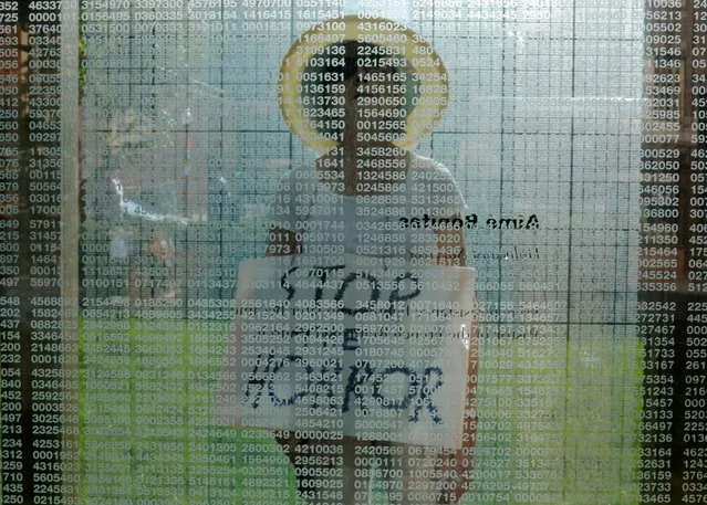 Doris Tennant walks through the Holocaust Memorial carrying a sign reading “Stop the Horror” during the Never Again Para Nadir protest against ICE Detention camps in Boston, Massachusetts, U.S., July 2, 2019. (Photo by Brian Snyder/Reuters)