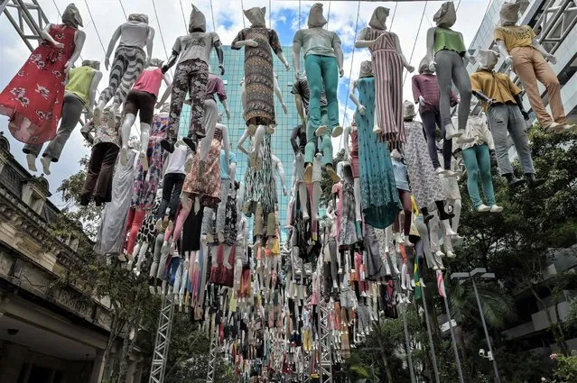 View of Renascimento (Rebirth), an installation by Brazilian artist Siron Franco, at Casa das Rosas cultural center, in Sao Paulo, Brazil, on January, 13, 2022. Renascimento is an installation formed by 365 mannequins suspended by wires, which pays tribute to the victims of the pandemic of COVID-19, to health professionals and at the same time celebrates life, according to the artist. (Photo by Nelson Almeida/AFP Photo)