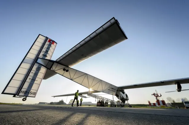 Experimental aircraft “Solar Impulse 2”, HB-SIB, is pictured during solar generator tests at the airbase in Payerne, Switzerland, 14 April 2014. The aircraft HB-SIB is the second solar plane of the Solar Impulse project. The main goal of the project is to circumnavigate the world with an aircraft, with a 72 metre wingspan, powered only by solar energy. (Photo by Laurent Gillieron/EPA)
