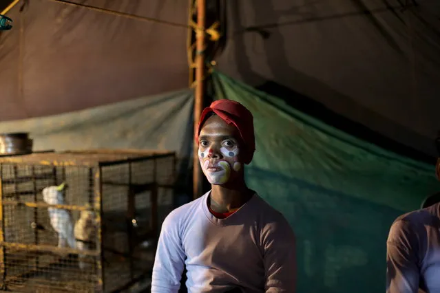 Clown Korim Sekh waits during a show of the Ajanta Circus amid Omicron outbreak and Covid 19 restrictions in Kolkata, India, 18 January 2022. The Ajanta Circus is so far the only circus that has managed to return to Kolkata  since the start of the still ongoing Covid19 two years ago. There are currently less then 30 circuses operating in India, with the number expected to further decrease in the pandemic. Performances by children were banned in 2011, adding to the ban of performances with wild animals which were banned already in 1991. (Photo by Piyal Adhikary/EPA/EFE)