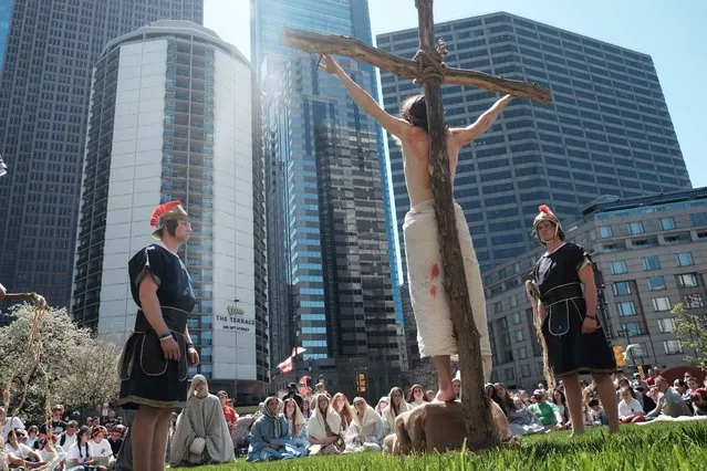 A person depicts Jesus as people help re-enact stations of the cross procession at the Cathedral Basilica of Saints Peter and Paul on April 15, 2022 in Philadelphia, Pennsylvania. The procession included dozens of members of a local mission youth group along with area Catholics and others. The Stations of the Cross, or the Way of the Cross, is performed on Good Friday around the world and depicts in a series of images Jesus Christ's last day on earth before his crucifixion. (Photo by Spencer Platt/Getty Images)