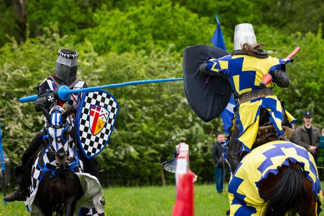 Re enactors as armoured knights take part in a Royal Coronation medieval jousting tournament at Chiltern Open Air Museum in Chalfont, UK on May 7 2023. The event is taking place of the Bank Holiday weekend following the coronation of King Charles III and Queen Camilla. The museum tells the story of the Chilterns area through the preservation of historic buildings, landscapes and culture. (Photo by Stephen Chung/Alamy Live News)