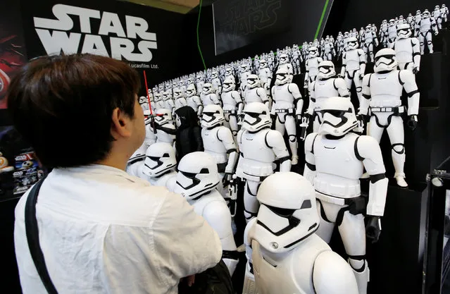 A man looks at Takara Tomy's figures of Kylo Ren (C) and Storm Troopers from “Star Wars” at the International Tokyo Toy Show in Tokyo, Japan June 9, 2016. (Photo by Toru Hanai/Reuters)