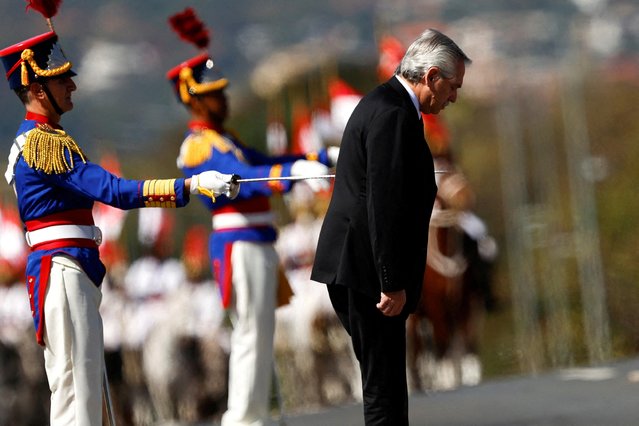 Argentina's President Alberto Fernandez reviews the honour guard before a meeting with Brazil's President Luiz Inacio Lula da Silva at the Planalto Palace in Brasilia, Brazil on June 26, 2023. (Photo by Adriano Machado/Reuters)