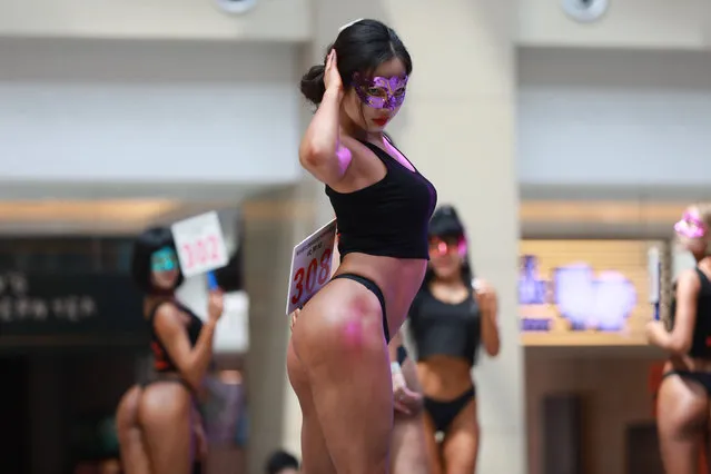 In this picture taken on June 24, 2017 participants take part in the “Women's Beautiful Buttock series” contest shopping mall in Shenyang, Liaoning province. (Photo by AFP Photo/Stringer)