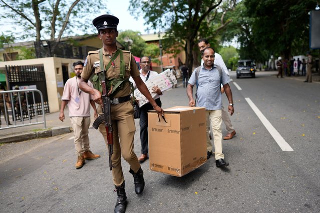 Election officials leave a distribution center after collecting polling material for the upcoming presidential election, in Colombo, Sri Lanka, Friday, September 20, 2024. (Photo by Eranga Jayawardena/AP Photo)