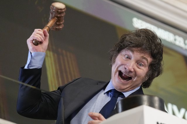 Argentina's President Javier Milei poses for pictures after ringing the opening bell at the New York Stock Exchange in New York, Monday, September 23, 2024. (Photo by Seth Wenig/AP Photo)