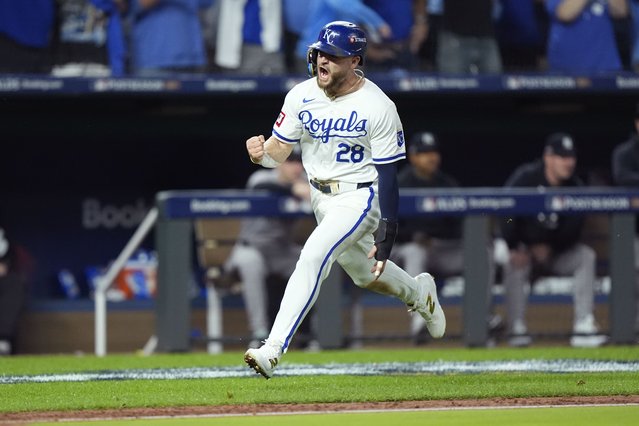 Kansas City Royals' Kyle Isbel (28) celebrates as he runs home to score on a triple by teammate Michael Massey during the fifth inning in Game 3 of an American League Division baseball playoff series against the New York Yankees Wednesday, October 9, 2024, in Kansas City, Mo. (Photo by Charlie Riedel/AP Photo)