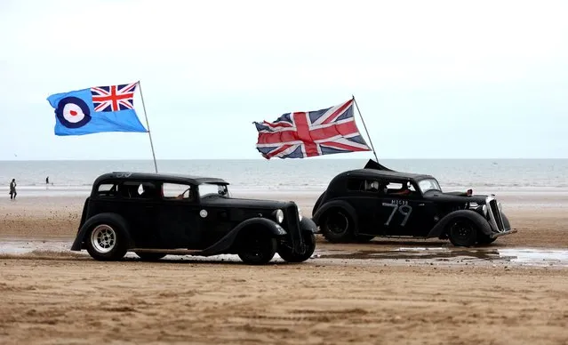 Motoring enthusiasts take part in the “Race The Wave” classic car meet on the beach at Bridlington, Britain on June 18, 2022. (Photo by Lee Smith/Reuters)