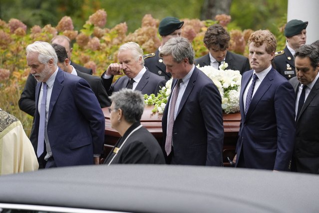 Pallbearers Max Kennedy, left, Chris Kennedy, behind center left, both sons of the late Ethel Kennedy, and Matt Kennedy, center front, and, Joseph Kennedy III, front second from right, both grandsons of Ethel Kennedy, carry her casket from Our Lady of Victory church, following funeral services, Monday, October 14, 2024, in Centerville, Mass. (Photo by Steven Senne/AP Photo)