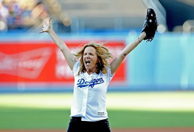 Actress Lea Thompson reacts after throwing out the first pitch before the game between the Cincinnati Reds and the Los Angeles Dodgers at Dodger Stadium on August 15, 2015 in Los Angeles, California, ahead of the after game showing of Back to Future on the stadium video boards. (Photo by Stephen Dunn/Getty Images)
