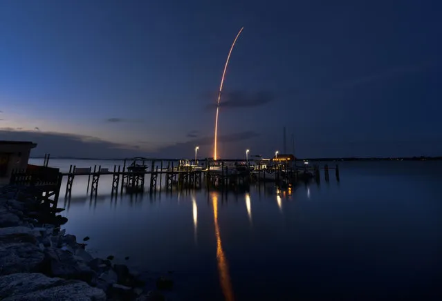 A SpaceX Falcon 9 rocket lifts off from Pad 39A at the Kennedy Space Center, Thursday, July 14, 2022  as seen from Cocoa Beach, Fla. The rocket is delivering supplies to the International Space Station. (Photo by Malcolm Denemark/Florida Today via AP Photo)