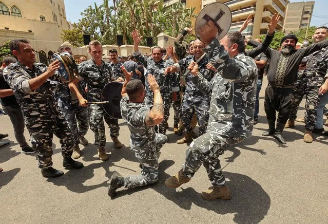 Members of Lebanese police dance as they celebrate Nabih Berri's re-election as parliament speaker in Beirut, Lebanon on May 31, 2022. (Photo by Aziz Taher/Reuters)