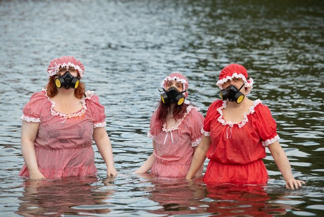 Ocean Rebellion wearing gas masks as they get into the River Thames on October 13, 2023. Wild Swimmers Henley Mermaids, Henley River Action, Thames 21, local swimmers, Earthwatch Europe and Ocean Rebellion came together today next to the River Thames in Henley-on-Thames in Oxfordshire to hold a protest about the health of the River Thames in Henley. (Photo by Maureen McLean/Rex Features/Shutterstock)