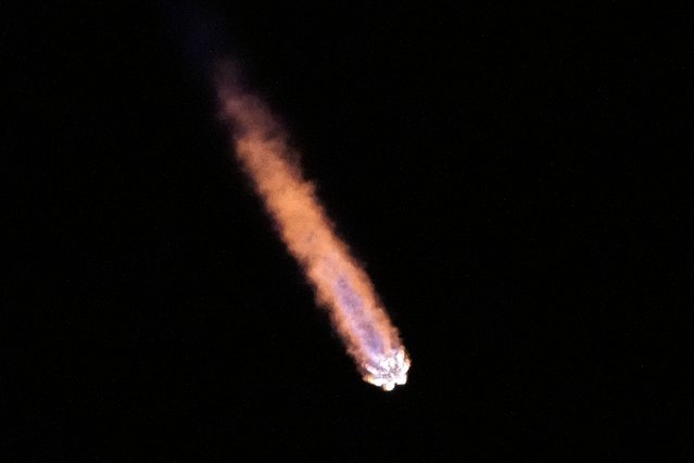 A SpaceX Falcon 9 rocket is seen in the sky after launching with a payload of a pair of lunar landers at the Kennedy Space Center in Cape Canaveral, Fla., Wednesday, January 15, 2025. (Photo by John Raoux/AP Photo)