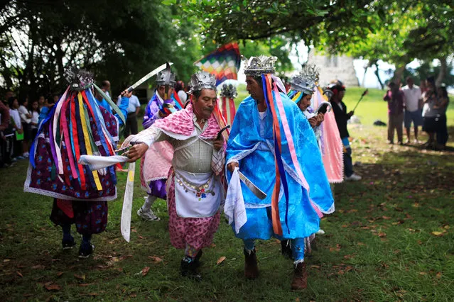 Traditional dancers participate in a traditional ceremony to commemorate the International Day of the World's Indigenous People in Izalco, El Salvador August 9, 2016. (Photo by Jose Cabezas/Reuters)