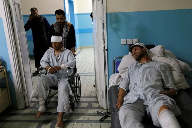 Men who were wounded after a suicide bomber detonated explosives near the entrance of the Russian embassy, are treated inside a hospital in Kabul, Afghanistan on September 5, 2022. (Photo by Ali Khara/Reuters)