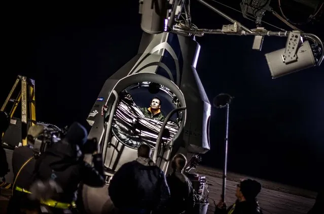 Pilot Felix Baumgartner of Austria sits in his capsule in preparation for the final manned flight of Red Bull Stratos in Roswell, N.M, on October 9, 2012. Baumgartner canceled his planned death-defying 23-mile free fall on Tuesday because of high winds, the second time this week he was forced to postpone his quest to be the first supersonic skydiver. (Photo by Red Bull Stratos)