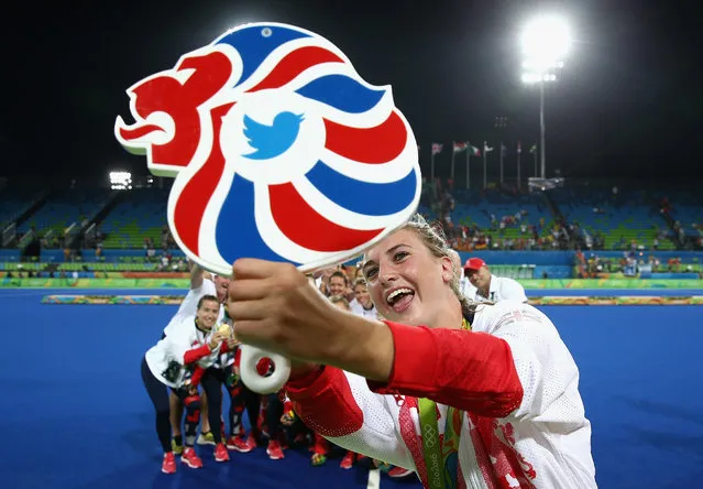 Team Great Britain pose with their gold medals for a selfie taken by Lily Owsley after defeating Netherlands in the Women's Gold Medal Match on Day 14 of the Rio 2016 Olympic Games at the Olympic Hockey Centre on August 19, 2016 in Rio de Janeiro, Brazil. (Photo by David Rogers/Getty Images)