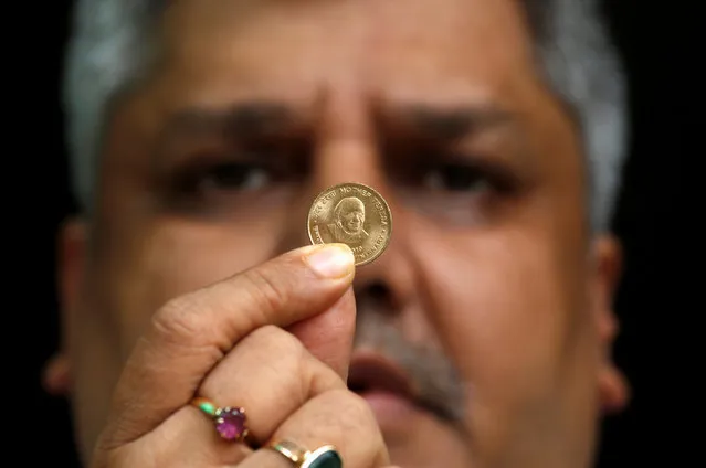 Alok Goyel displays a five rupee coin, which was issued by Indian government in 2010, with an image of Mother Teresa from his collection ahead of Mother Teresa's canonisation ceremony in Kolkata, India, September 2, 2016. (Photo by Rupak De Chowdhuri/Reuters)