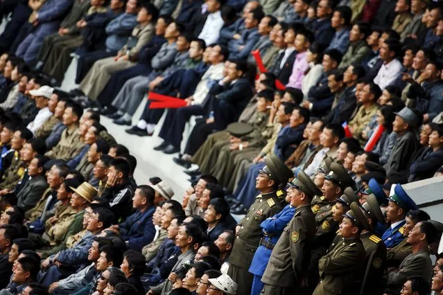 North Korean fans watch their team's preliminary 2018 World Cup and 2019 AFC Asian Cup qualifying soccer match against Philippines at the Kim Il Sung Stadium in Pyongyang October 8, 2015. (Photo by Damir Sagolj/Reuters)