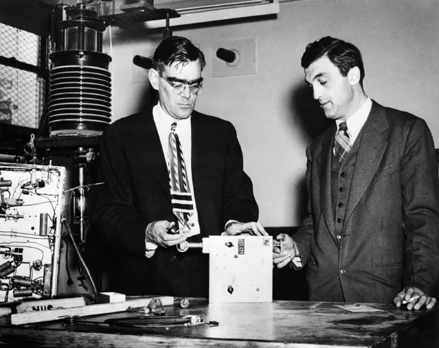 Dr. Felix Bloch, right, Stanford University professor of physics, and Dr. William W. Hansen, director of the Stanford Microwave Laboratory, examine a working model of equipment used in their research work, January 23, 1947, in Stanford. (Photo by AP Photo)