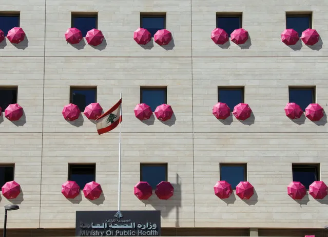 Pink umbrellas decorate the facade of the Ministry of Public Health, part of a campaign aiming at raising awareness of breast cancer prevention, in Beirut, Lebanon September 30, 2016. (Photo by Mohamed Azakir/Reuters)