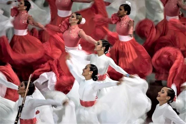 Dancers perform during the presentation of the annual report on the activities of judicial bodies, in Caracas, Venezuela, 31 January 2023. The Venezuelan Judiciary increased by 74% the number of sentences issued by specialized and non-specialized courts throughout the country during the past year compared to 2021, said this 31 January the president of the Supreme Court of Justice (TSJ), Gladys Gutierrez, in the presentation of the annual report of the activities of the judicial bodies. (Photo by Miguel Gutierrez/EPA/EFE)