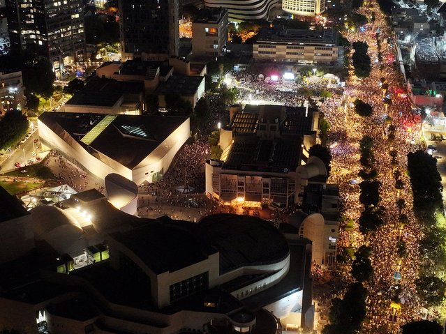 A drone view shows people protesting after families of hostages called for a nationwide strike to demand the return of all hostages and an end to the war in Gaza, in the area of the so-called Hostages Square, in Tel Aviv, Israel, on August 17, 2025. (Photo by Aviv Atlas/Reuters)