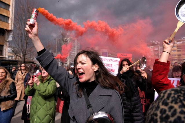 Women take part in a rally for gender equality and against violence towards women to mark the International Women's Day in Pristina, on March 8, 2023. (Photo by Armend Nimani/AFP Photo)