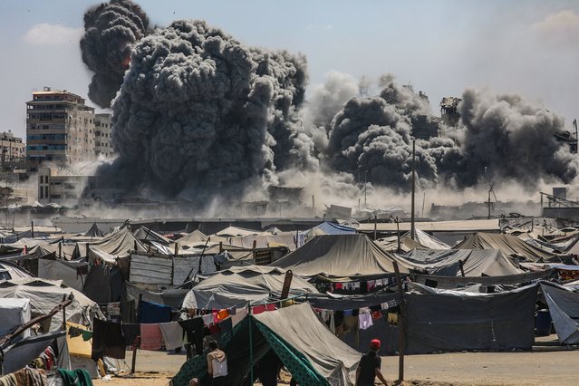 Smoke rises at the Harmony Tower following an Israeli airstrike in the west of Gaza City, Gaza Strip, 10 September 2025. (Photo by Mohammed Saber/EPA)