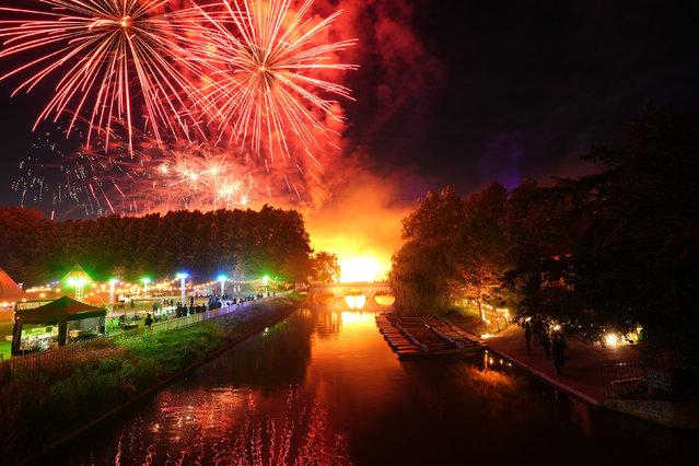 A firework display over the River Cam during the Trinity May Ball at Cambridge University's Trinity College on Monday, June 17, 2024. A celebration of the end of the academic year, the first official May Ball was held in Trinity College's grounds in 1866 with the tradition quickly spreading to the other colleges. (Photo by Joe Giddens/PA Images via Getty Images)