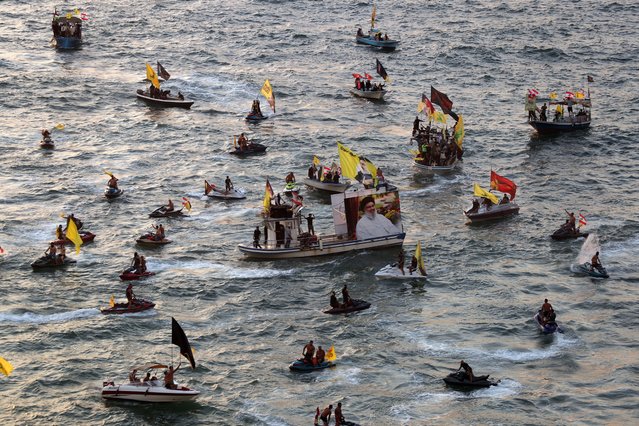 Supporters of Hezbollah sail near Raouche Rock during an event organized by Hezbollah to mark the first anniversary of the deaths of the late Hezbollah leaders Hassan Nasrallah and Hashem Safieddine in Beirut, Lebanon, 25 September 2025. Nasrallah was killed on 27 September 2024 in an Israeli airstrike targeting a Hezbollah command center in Haret Hreik. Safieddine, briefly named as his successor, was killed days later in a separate Israeli strike. (Photo by Wael Hamzeh/EPA)