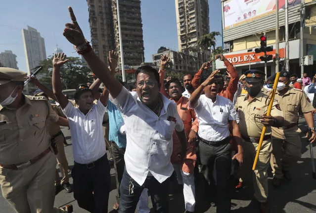 Activists shout slogans as police detain them during a protest against new farm laws in Mumbai, India, Wednesday, January 27, 2021. Leaders of a protest movement sought Wednesday to distance themselves from a day of violence when thousands of farmers stormed India's historic Red Fort, the most dramatic moment in two months of demonstrations that have grown into a major challenge of Prime Minister Narendra Modi’s government. (Photo by Rafiq Maqbool/AP Photo)