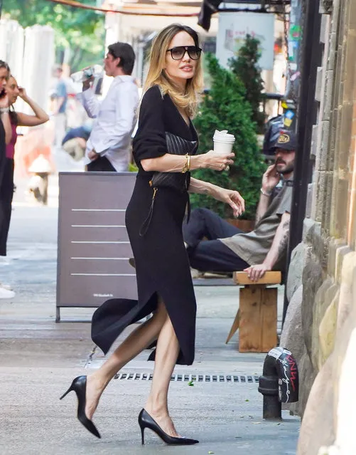 Angelina Jolie is spotted out in The West Village in New York City on June 28, 2023. The American actress carried a cup of coffee and wore a black dress with matching heels. (Photo by The Image Direct)