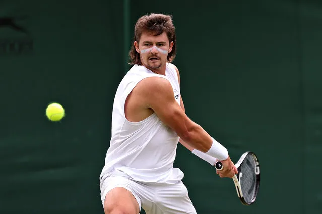 J.J. Wolf of United States plays a backhand against Alexander Bublik of Kazakhstan in the Men's Singles second round match during day four of The Championships Wimbledon 2023 at All England Lawn Tennis and Croquet Club on July 06, 2023 in London, England. (Photo by Michael Regan/Getty Images)