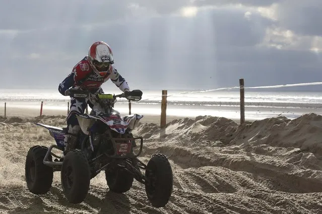 Jeremie Warnia of France rides on his way to win the “Quaduro” endurance race on the beach of Le Touquet January 31, 2015. About 1100 motorbike and 600 quad bike riders descend on Le Touquet every year for the racing endurance event. (Photo by Pascal Rossignol/Reuters)