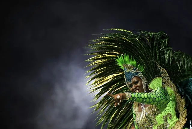 A reveller from the Mancha Verde Samba School takes part in a carnival at Anhembi Sambadrome in Sao Paulo February 13, 2015. (Photo by Nacho Doce/Reuters)