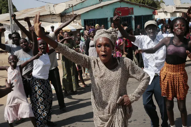 Gambians celebrate the victory of opposition coalition candidate Adama Barrow against longtime President Yahya Jammeh in the streets of Serrekunda, Gambia, Friday December 2, 2016. (Photo by Jerome Delay/AP Photo)